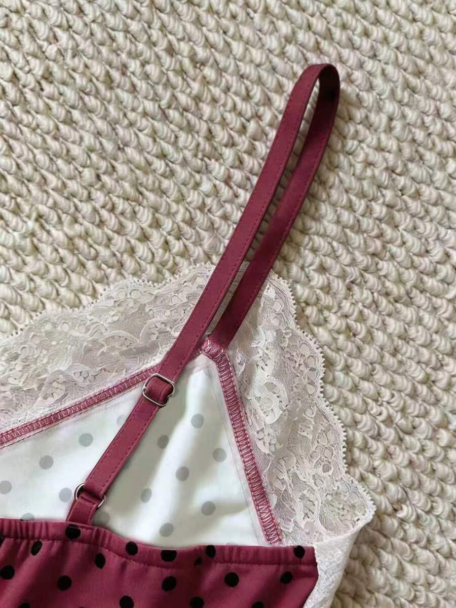 Women's solid color slim fit camisole top featuring delicate lace patchwork embroidery and tank straps.
