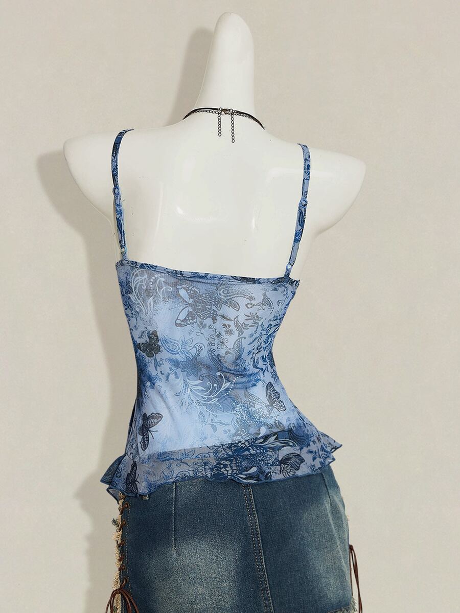 Women's burgundy floral graphic print mesh camisole top featuring an asymmetrical hem, backless cut, and spaghetti straps.