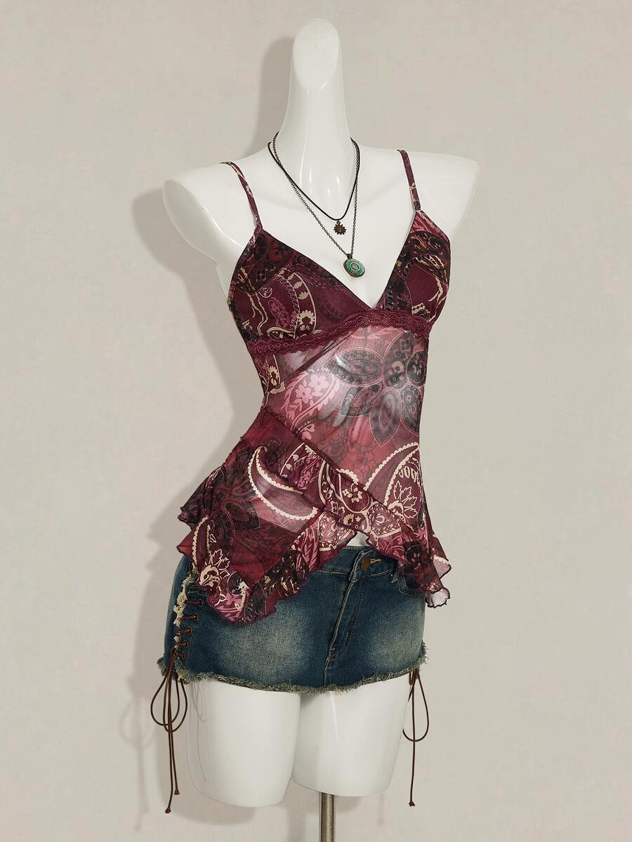 Women's burgundy floral graphic print mesh camisole top featuring an asymmetrical hem, backless cut, and spaghetti straps.