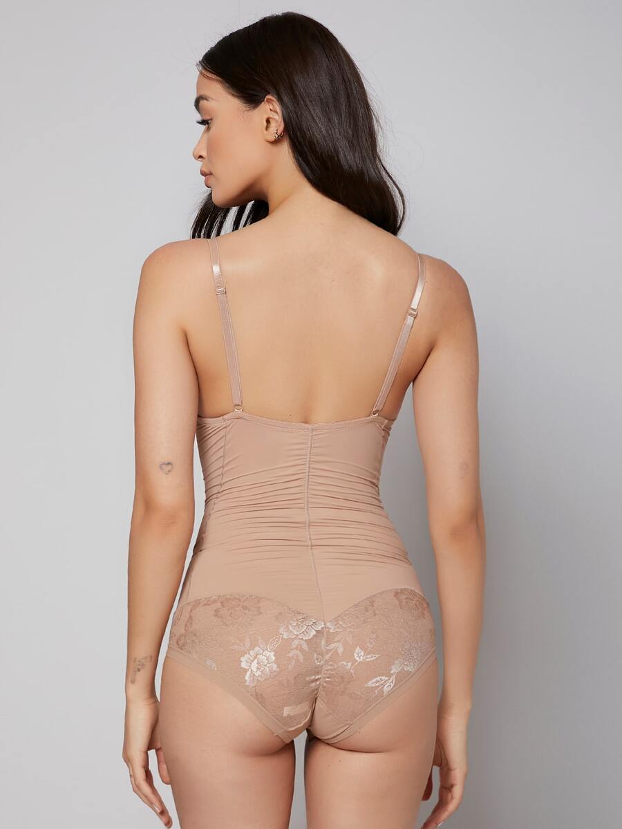 Apricot backless shapewear teddy bodysuit featuring contrast lace trim, non-removable padding, and underwire support.