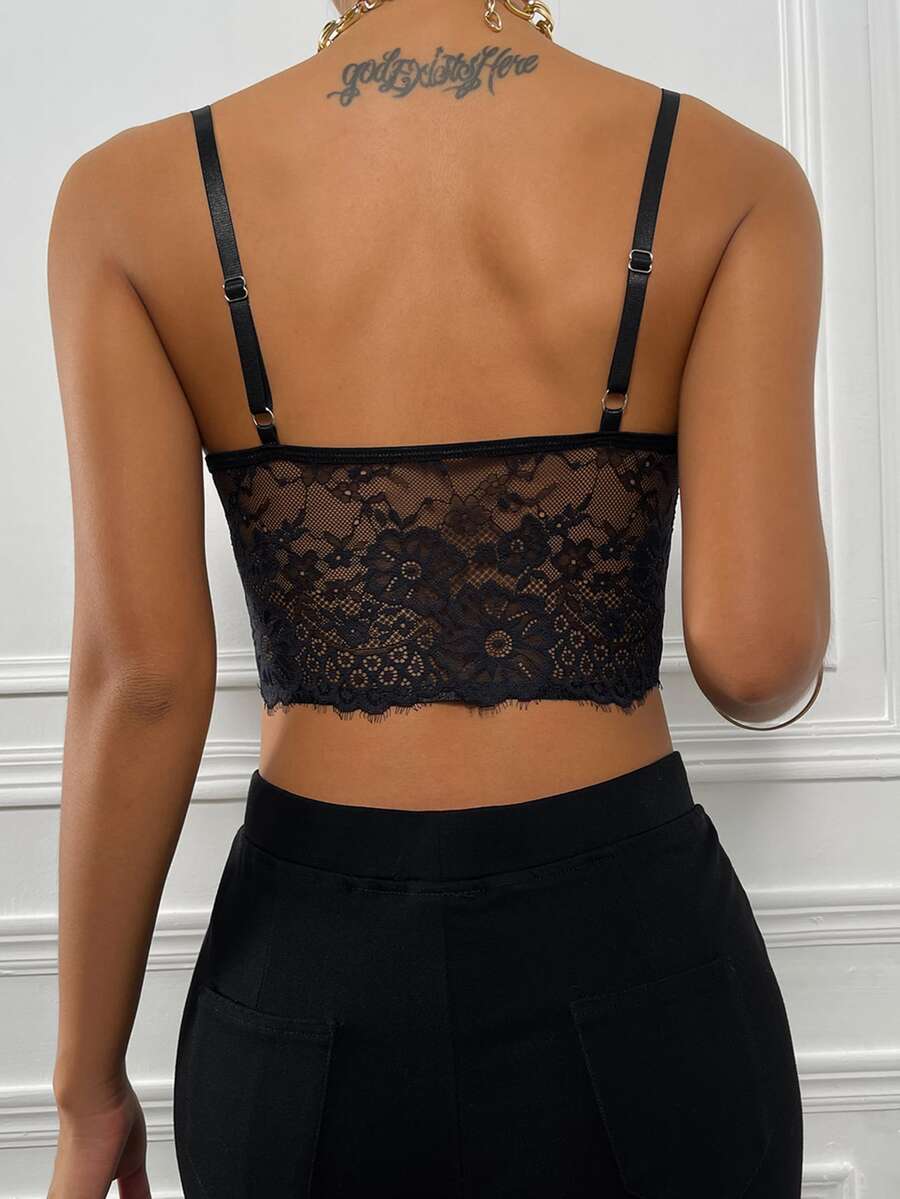 Women wearing a black lace bustier crop cami top with spaghetti straps and slim fit corset detailing.
