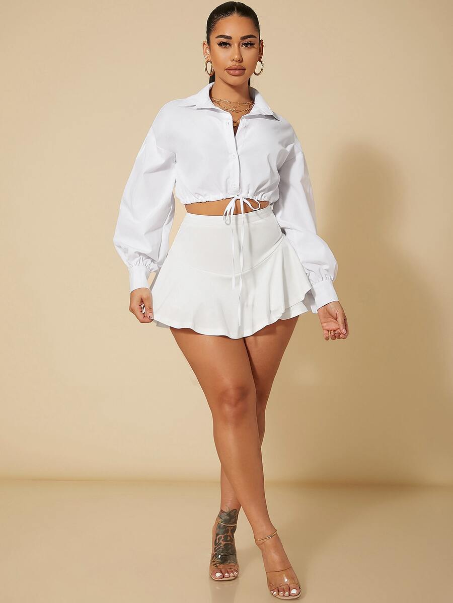 Black high waist ruffle hem skort for women featuring an elastic waistband and lined design.