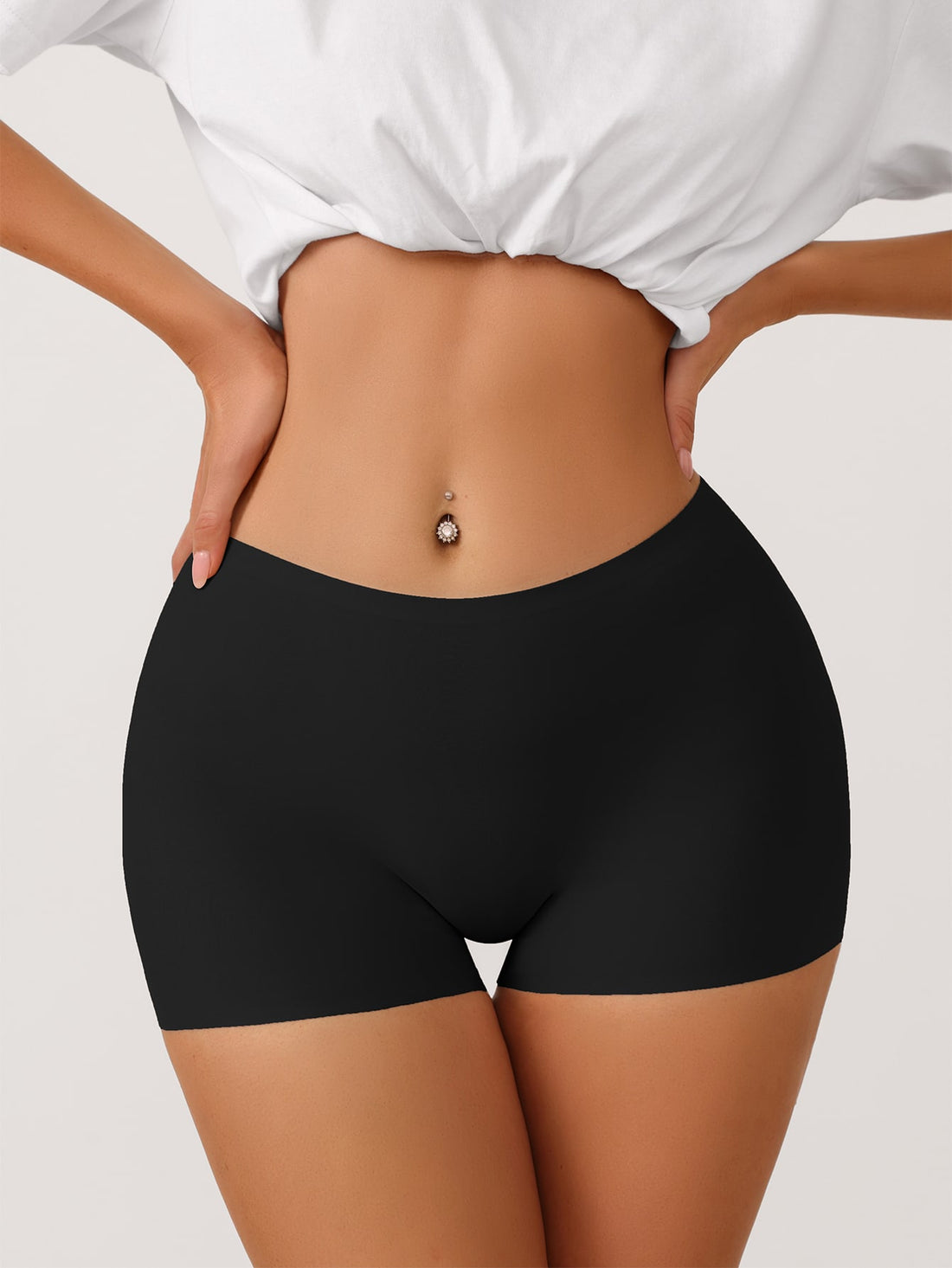 Women's black seamless shapewear leggings featuring high stretch semi-sheer fabric and a natural mid waist.