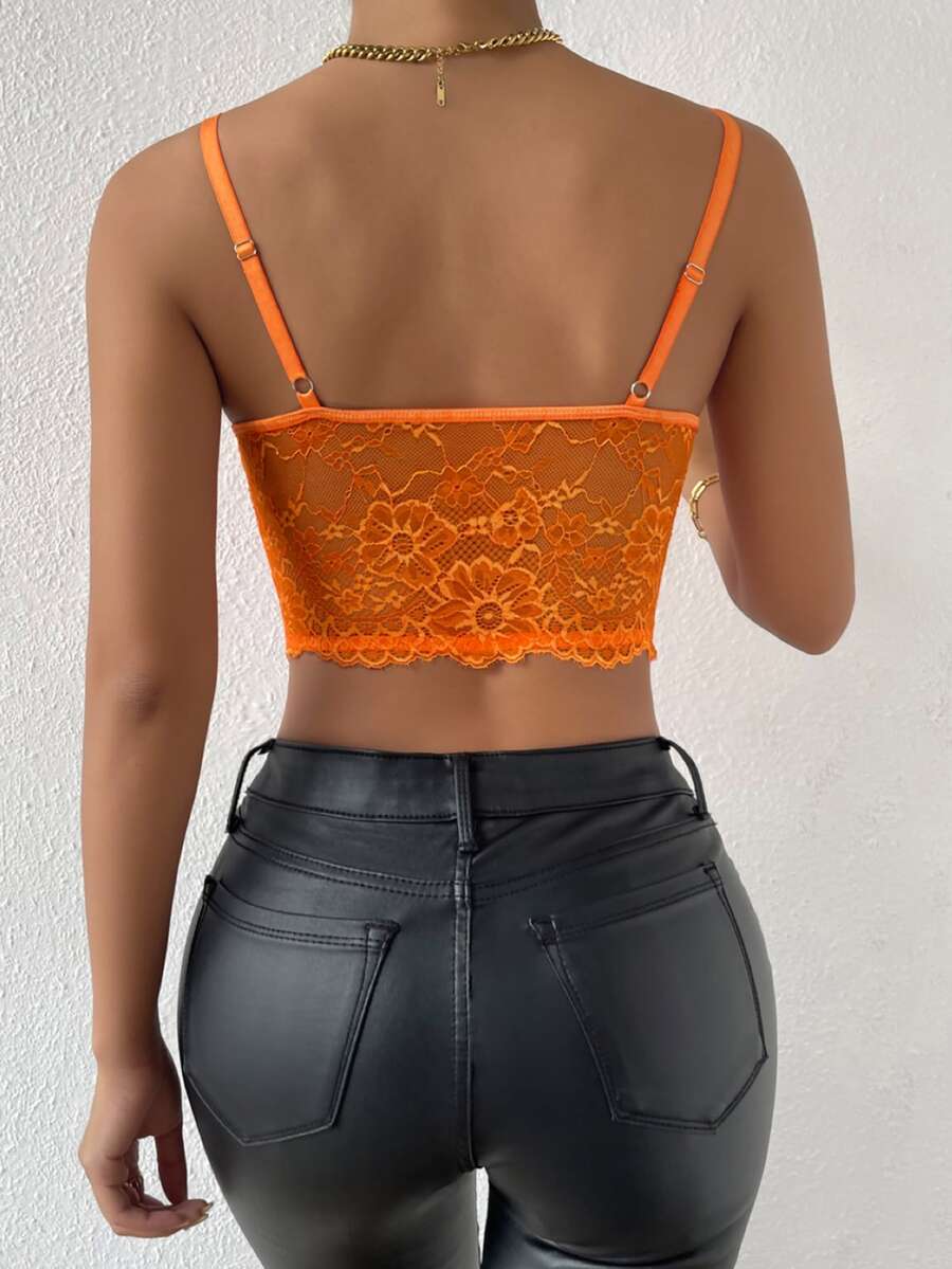 Women wearing a black lace bustier crop cami top with spaghetti straps and slim fit corset detailing.