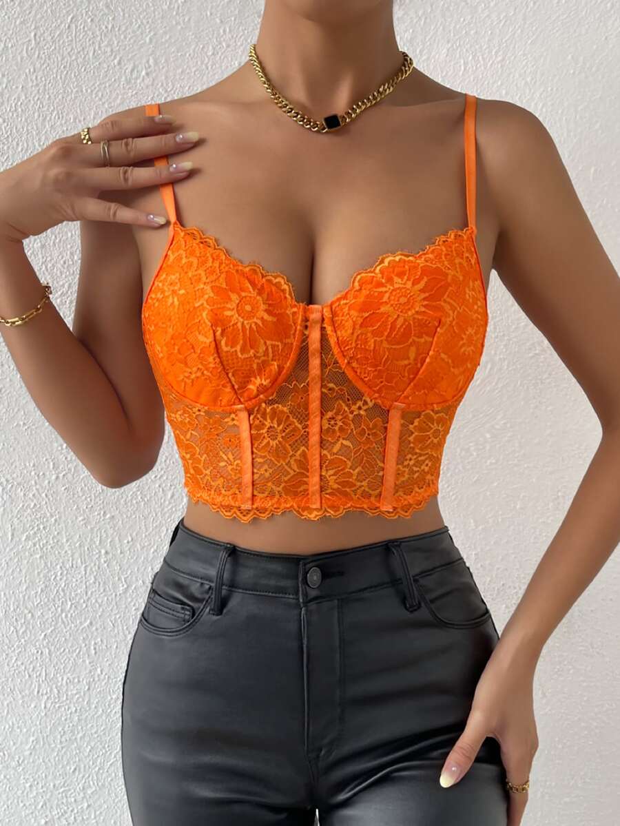 Women wearing a black lace bustier crop cami top with spaghetti straps and slim fit corset detailing.