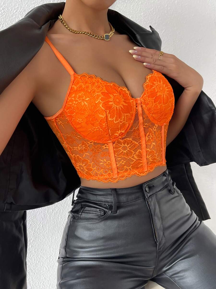 Women wearing a black lace bustier crop cami top with spaghetti straps and slim fit corset detailing.