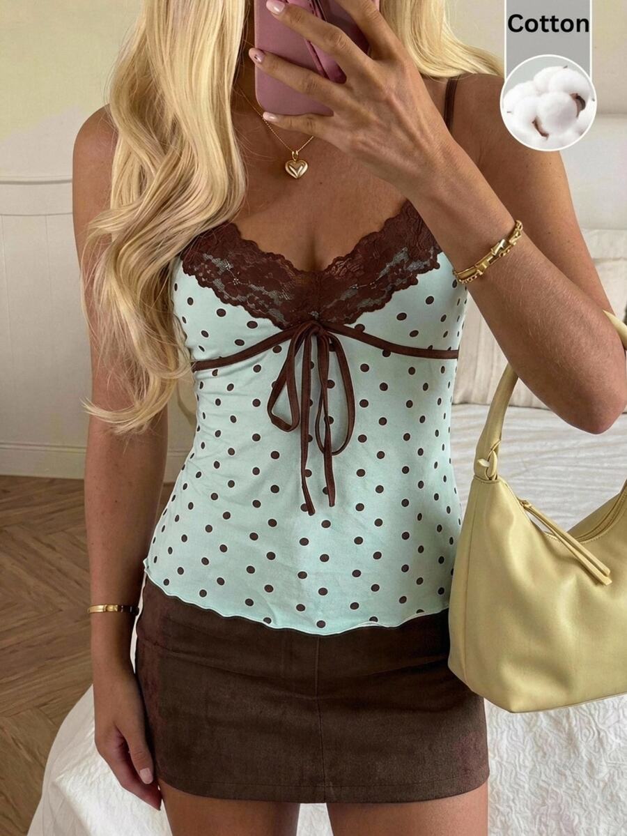 Black and white polka dot tie strap camisole top for women with thin spaghetti straps and slim fit.