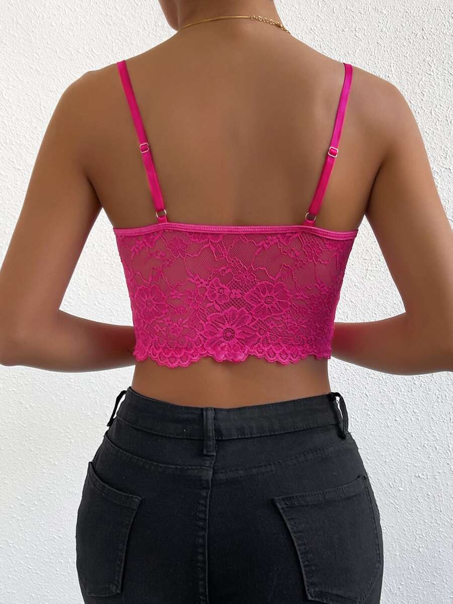 Women wearing a black lace bustier crop cami top with spaghetti straps and slim fit corset detailing.
