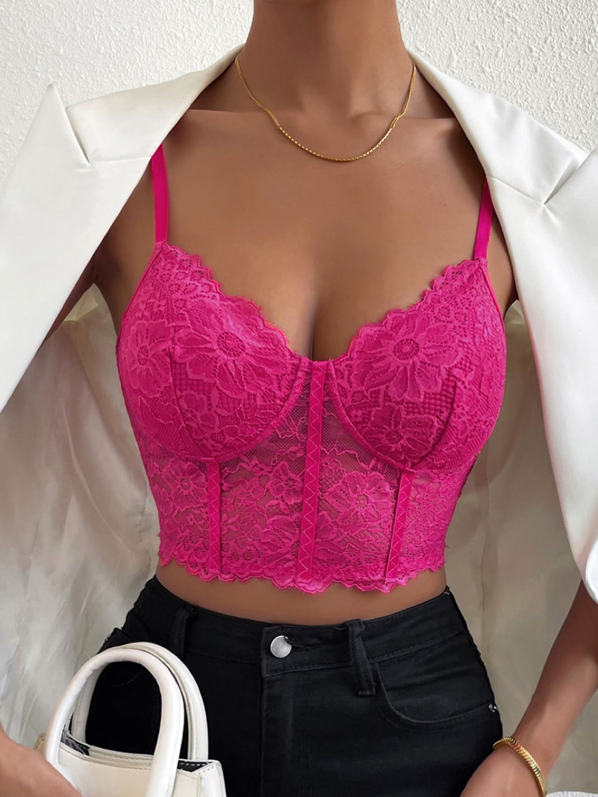 Women wearing a black lace bustier crop cami top with spaghetti straps and slim fit corset detailing.