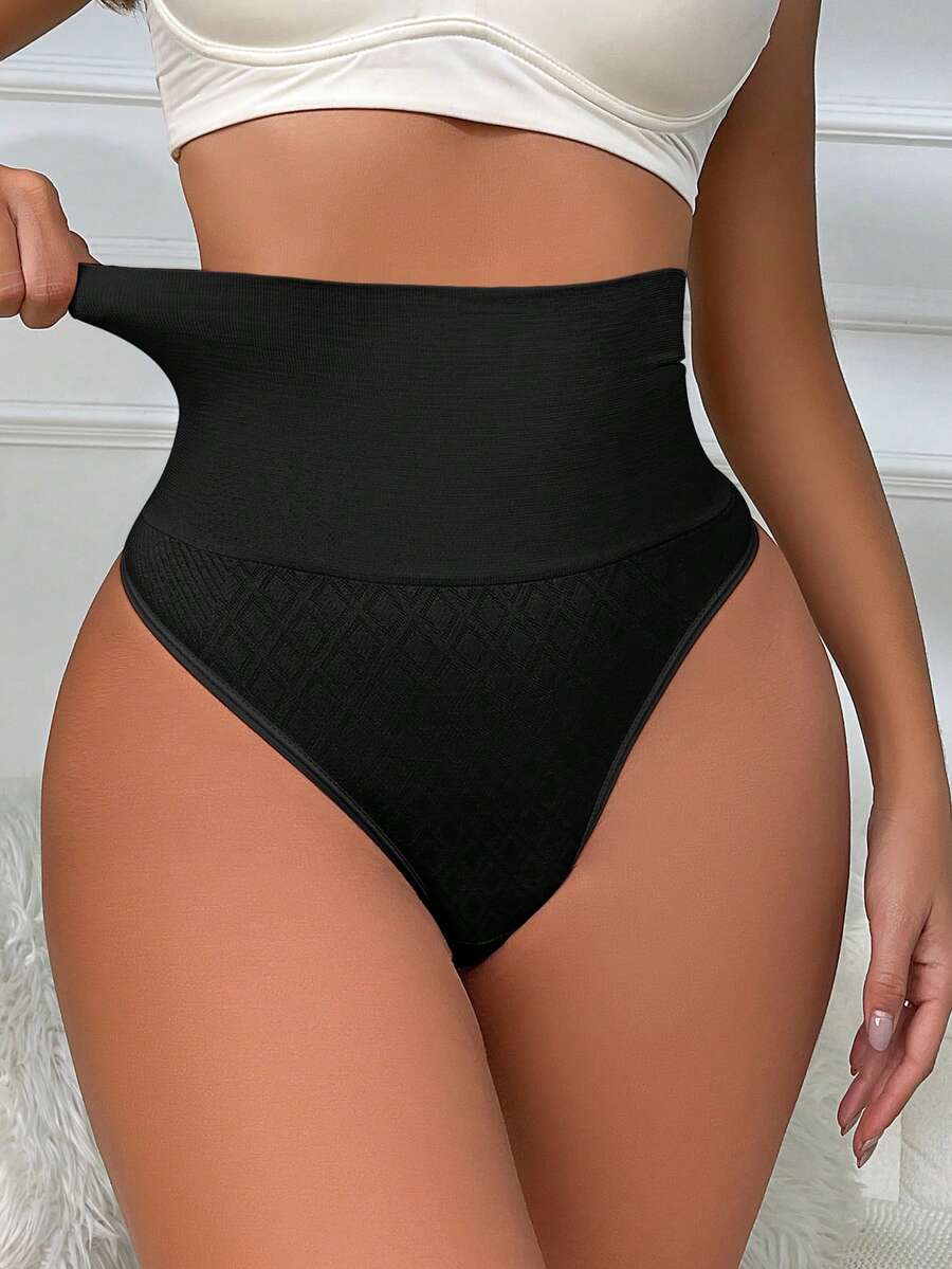 Black high waisted seamless shapewear thong for women featuring super high waist design and stretchy breathable fabric.