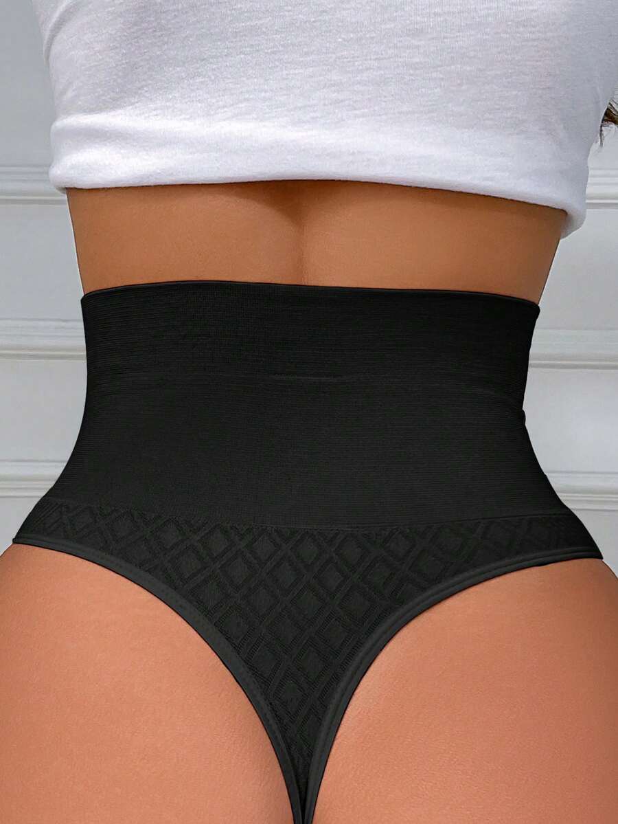 Black high waisted seamless shapewear thong for women featuring super high waist design and stretchy breathable fabric.