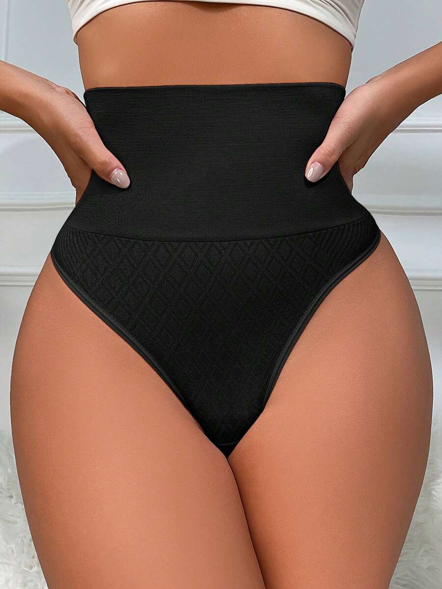 Black high waisted seamless shapewear thong for women featuring super high waist design and stretchy breathable fabric.