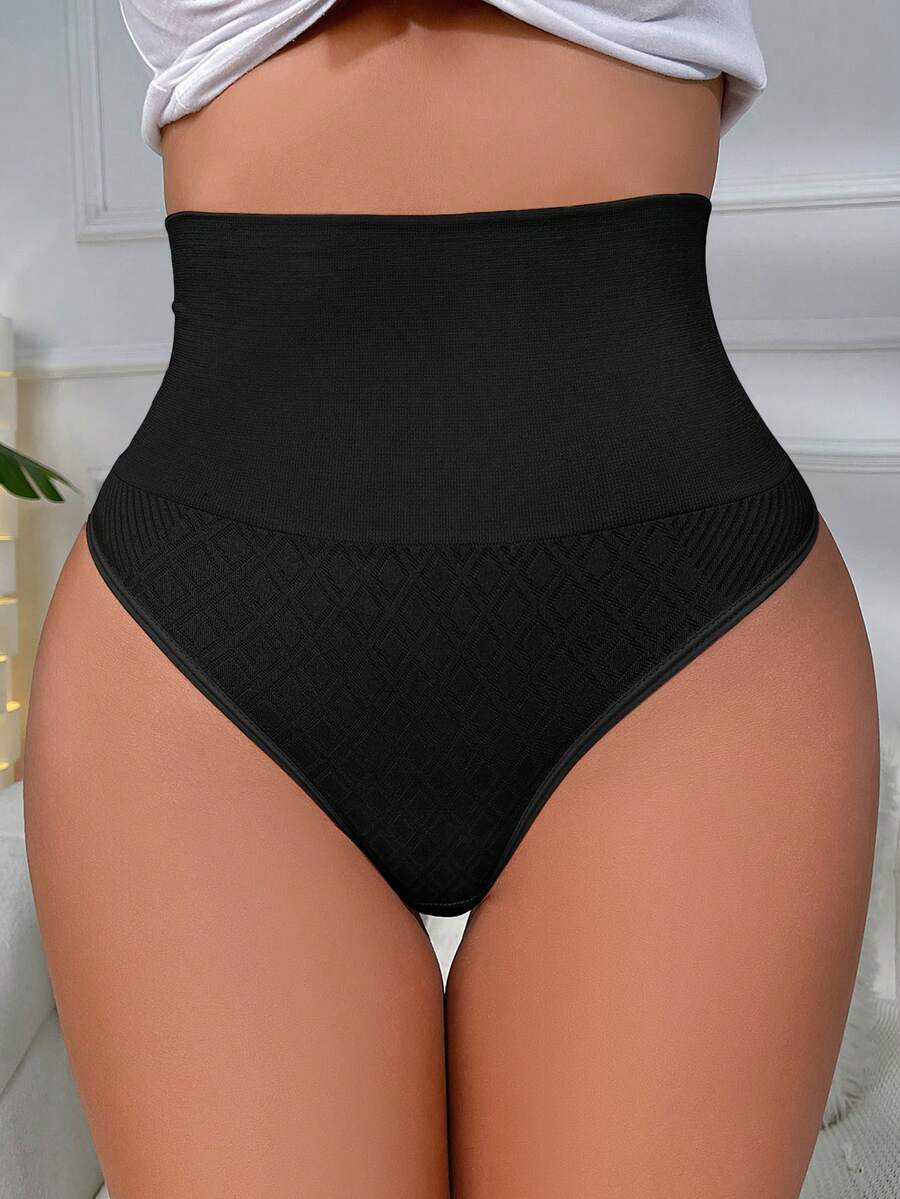 Black high waisted seamless shapewear thong for women featuring super high waist design and stretchy breathable fabric.