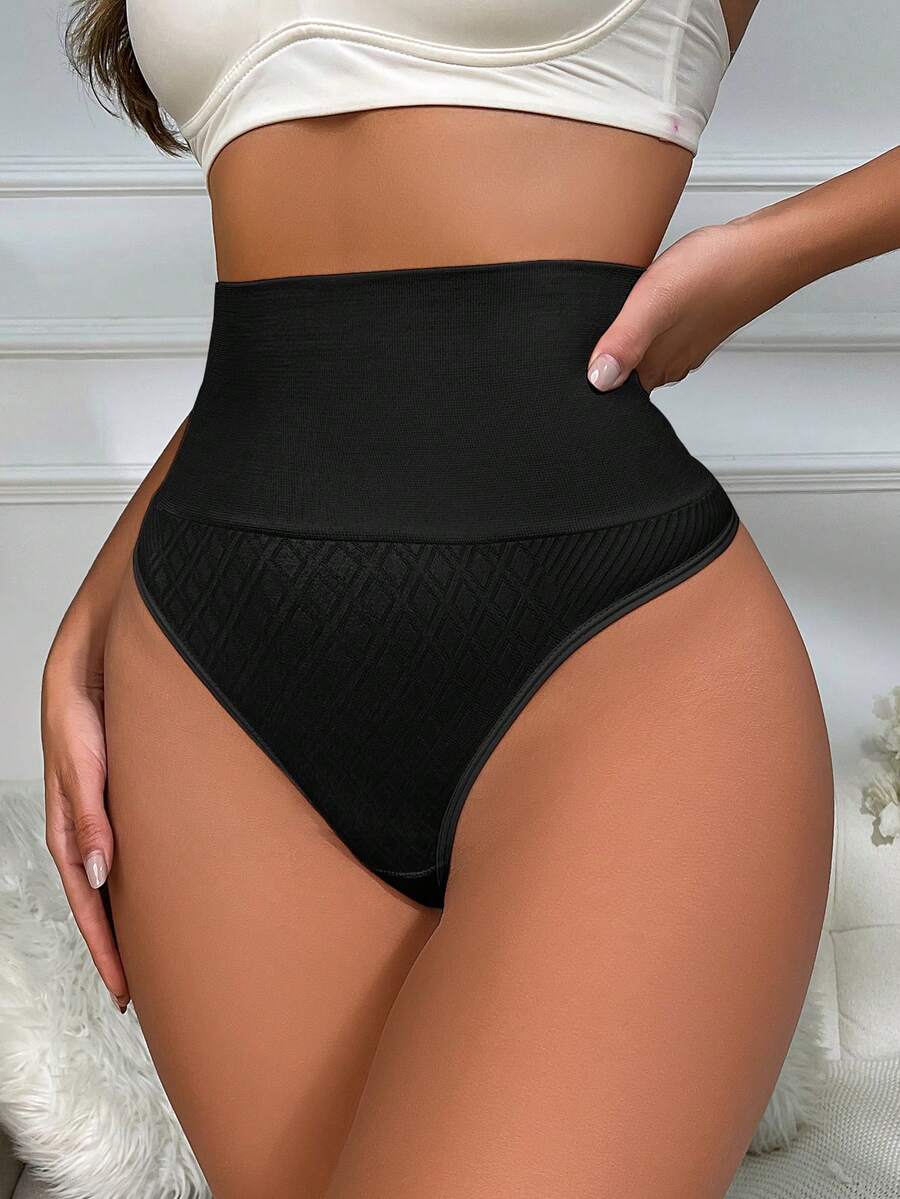 Black high waisted seamless shapewear thong for women featuring super high waist design and stretchy breathable fabric.