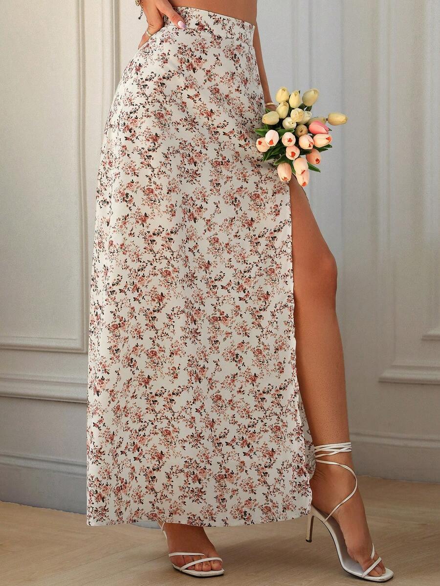 Women's black boho ditsy floral print maxi skirt featuring a high waist and a stylish split thigh slit detail.