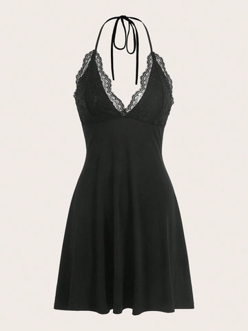 Front and back view of a black backless halter neck mini dress featuring a high waist and flared hem.