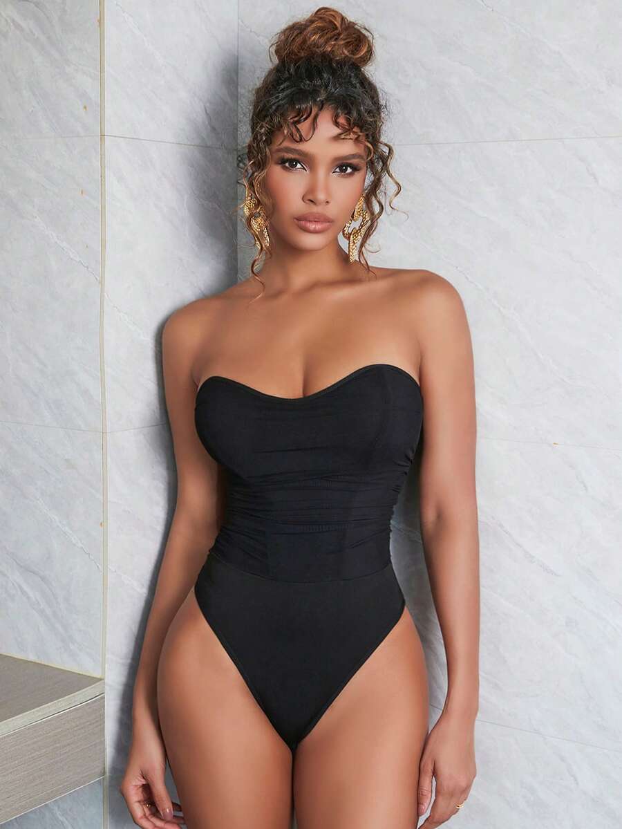 Black mesh ruched tube corset top for women featuring a strapless and backless slim fit design.