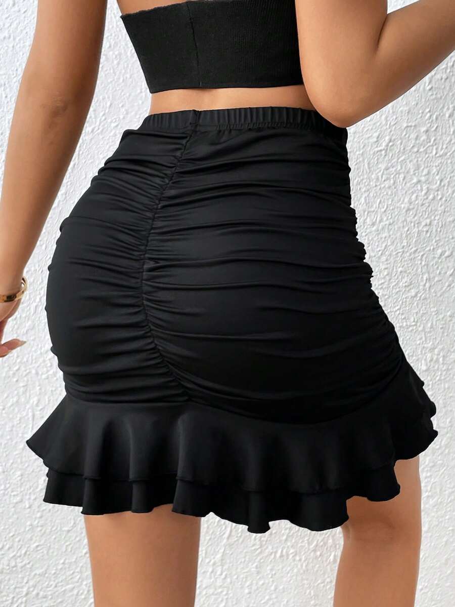 Black high waist ruched bodycon mini skirt featuring a tiered ruffle hem and skinny casual fit for women.