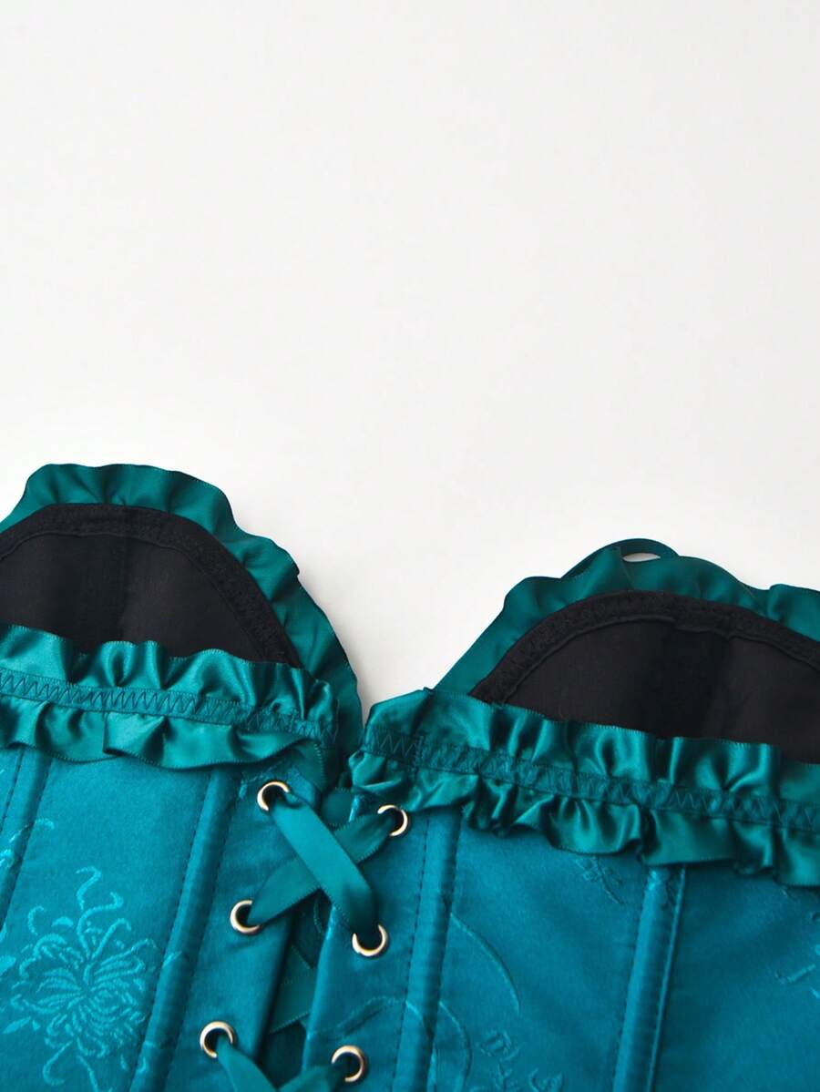 Women’s strapless corset bustier top with front button detail, lace-up back, frill accents, slim fit, and asymmetrical hem.