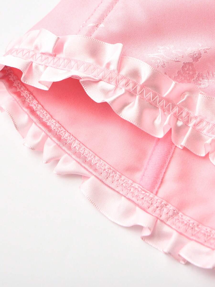 Women’s strapless corset bustier top with front button detail, lace-up back, frill accents, slim fit, and asymmetrical hem.