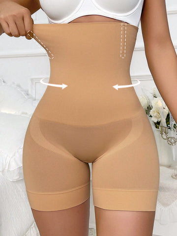Apricot high stretch super high waist long shapewear shorts with textured pattern and semi-sheer fabric for women.