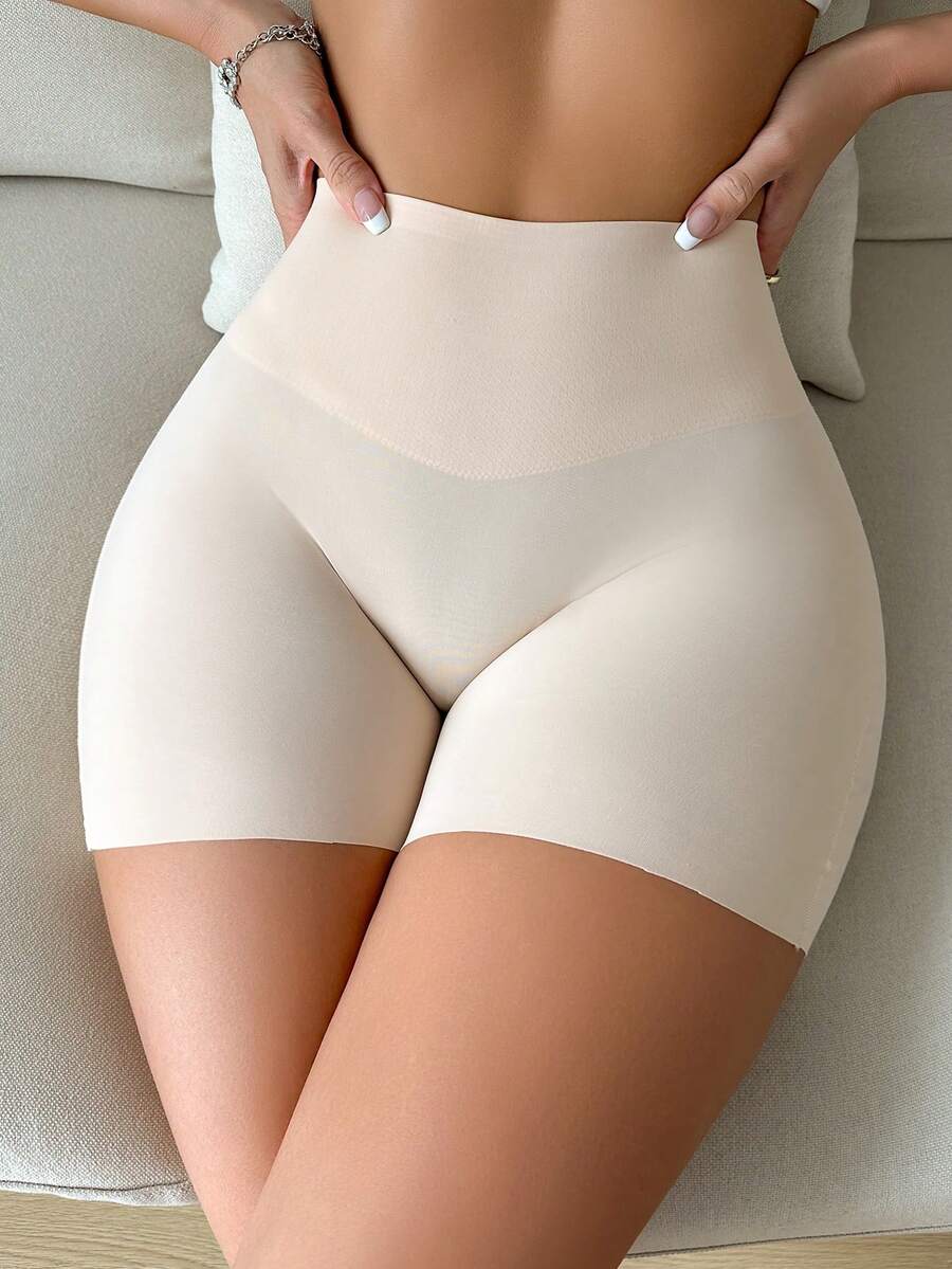 Women wearing apricot super high waist shapewear shorts designed for ultra-light thigh smoothing