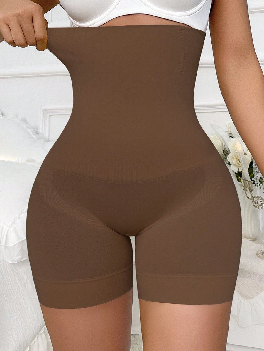 Apricot high stretch super high waist long shapewear shorts with textured pattern and semi-sheer fabric for women.