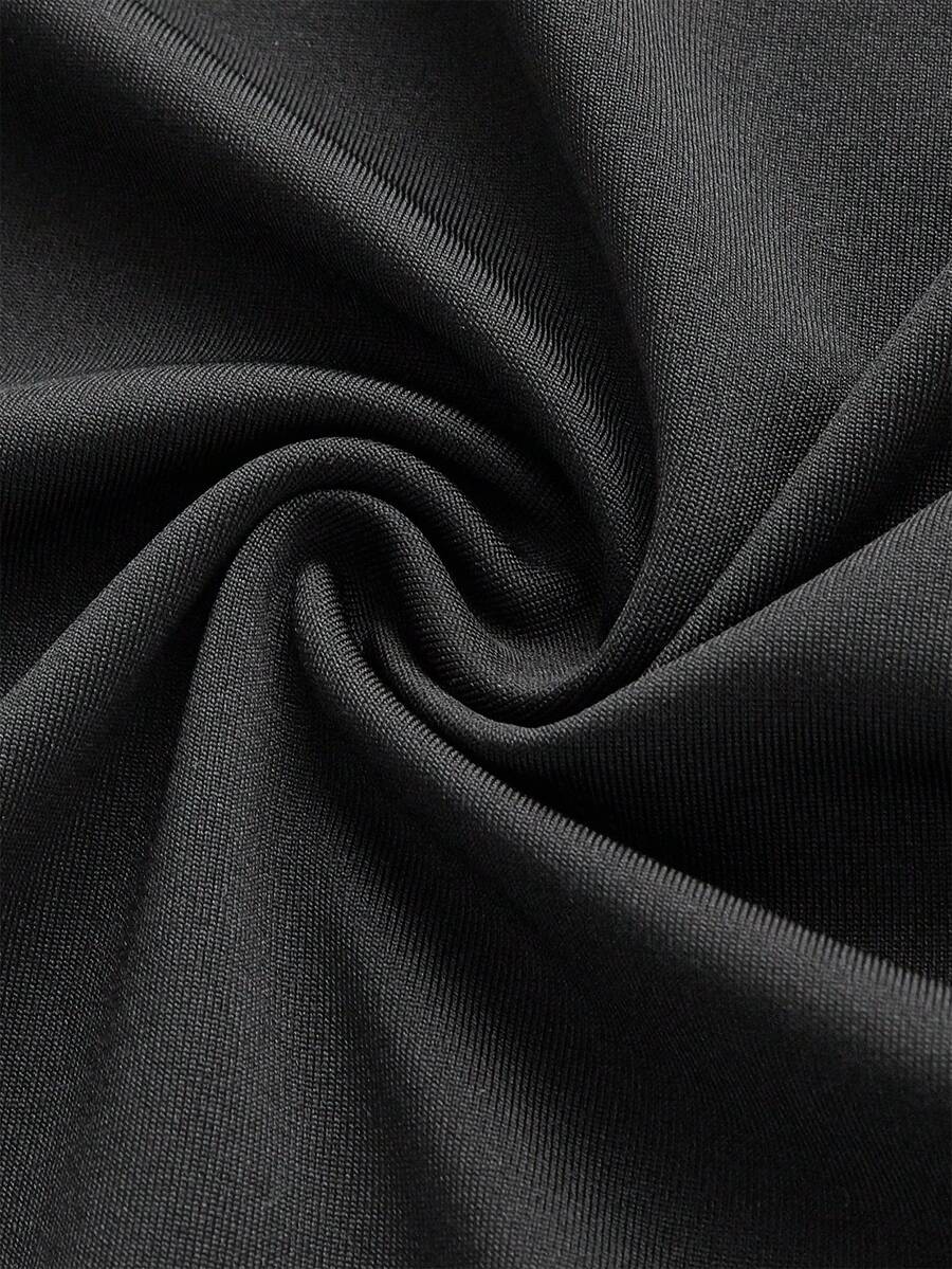 Women's ruffled slit hem skirt in black with criss-cross details, split thigh, skinny mermaid fit, and mid-waist style.