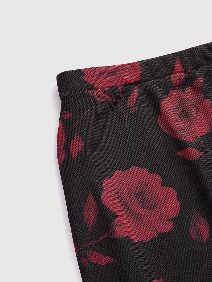Women's Floral Pattern Mesh Skirt in black featuring a high waist, long mermaid cut, side split, and ruffle lettuce trim.