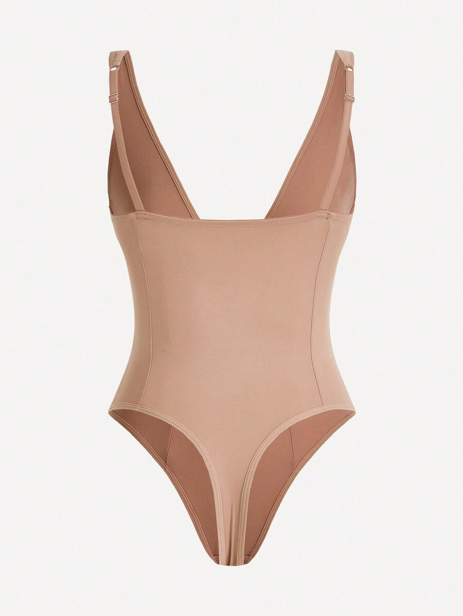 Apricot backless shapewear bodysuit with thong cut, cup details, and high-stretch fabric for light tummy support.