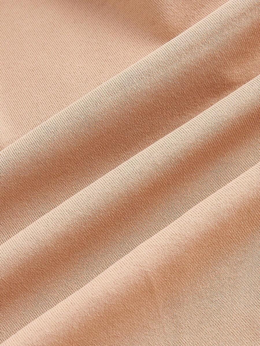 Apricot backless shapewear bodysuit with thong cut, cup details, and high-stretch fabric for light tummy support.