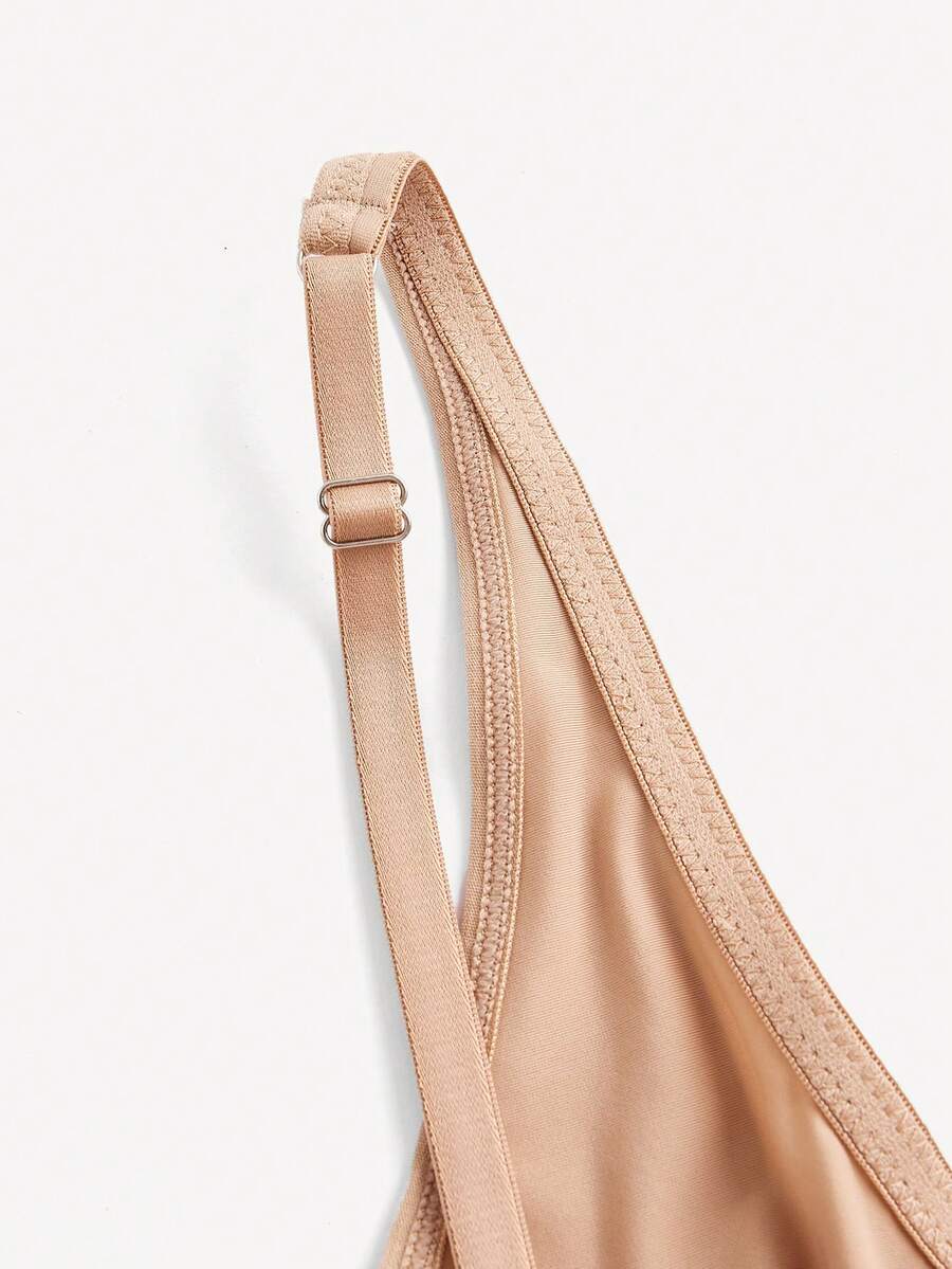 Apricot backless shapewear bodysuit with thong cut, cup details, and high-stretch fabric for light tummy support.