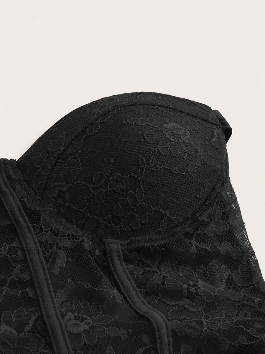 Women's black backless lace splice halterneck mini dress with slim fit and knot detail
