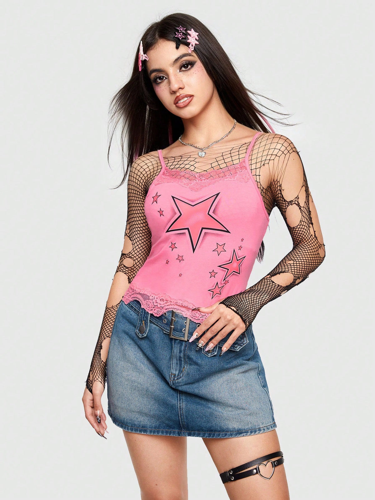 Pink floral camisole top featuring contrast lace trim, lettuce edge detail, and spaghetti straps for women.