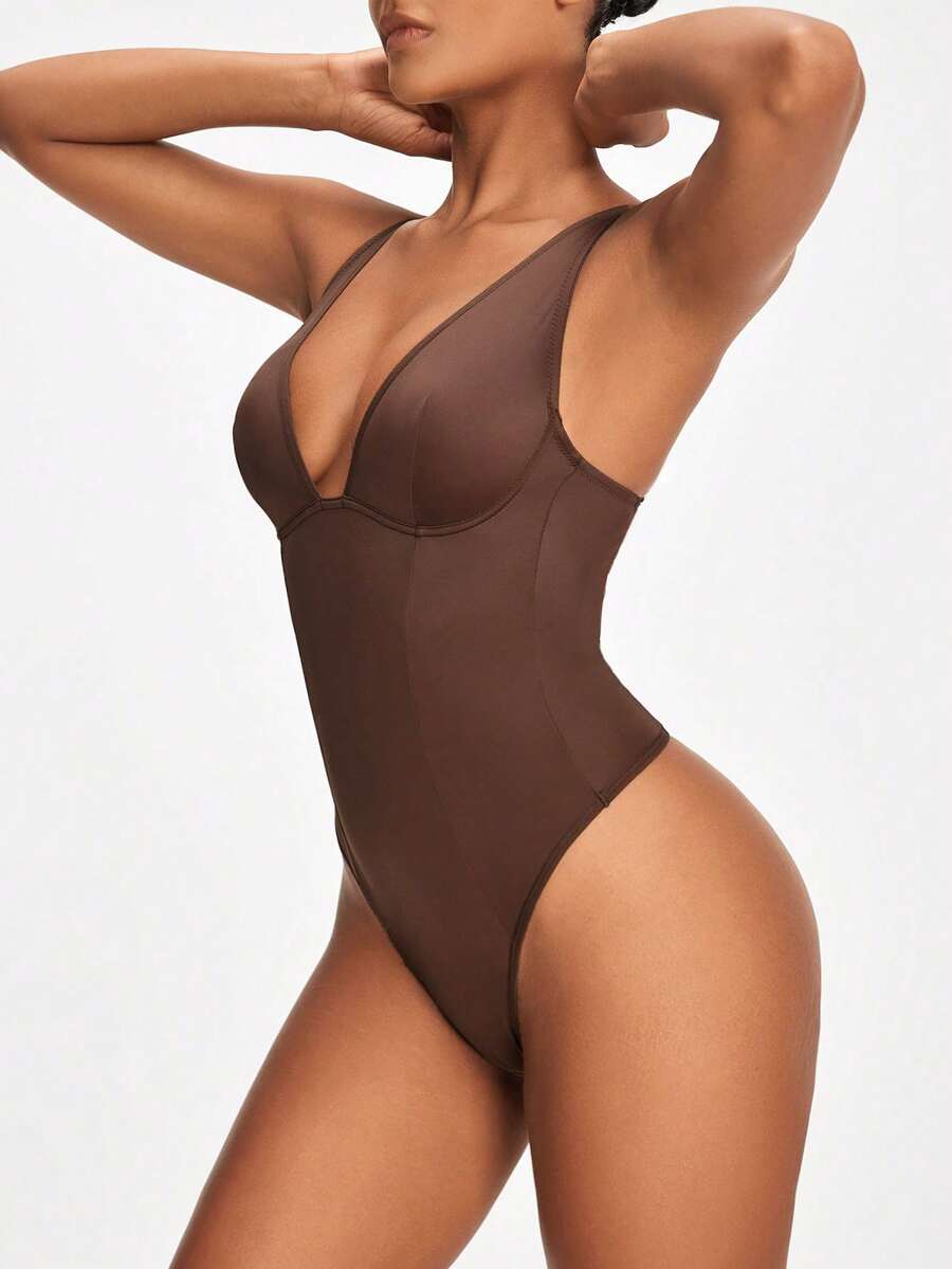 Apricot backless shapewear bodysuit with thong cut, cup details, and high-stretch fabric for light tummy support.