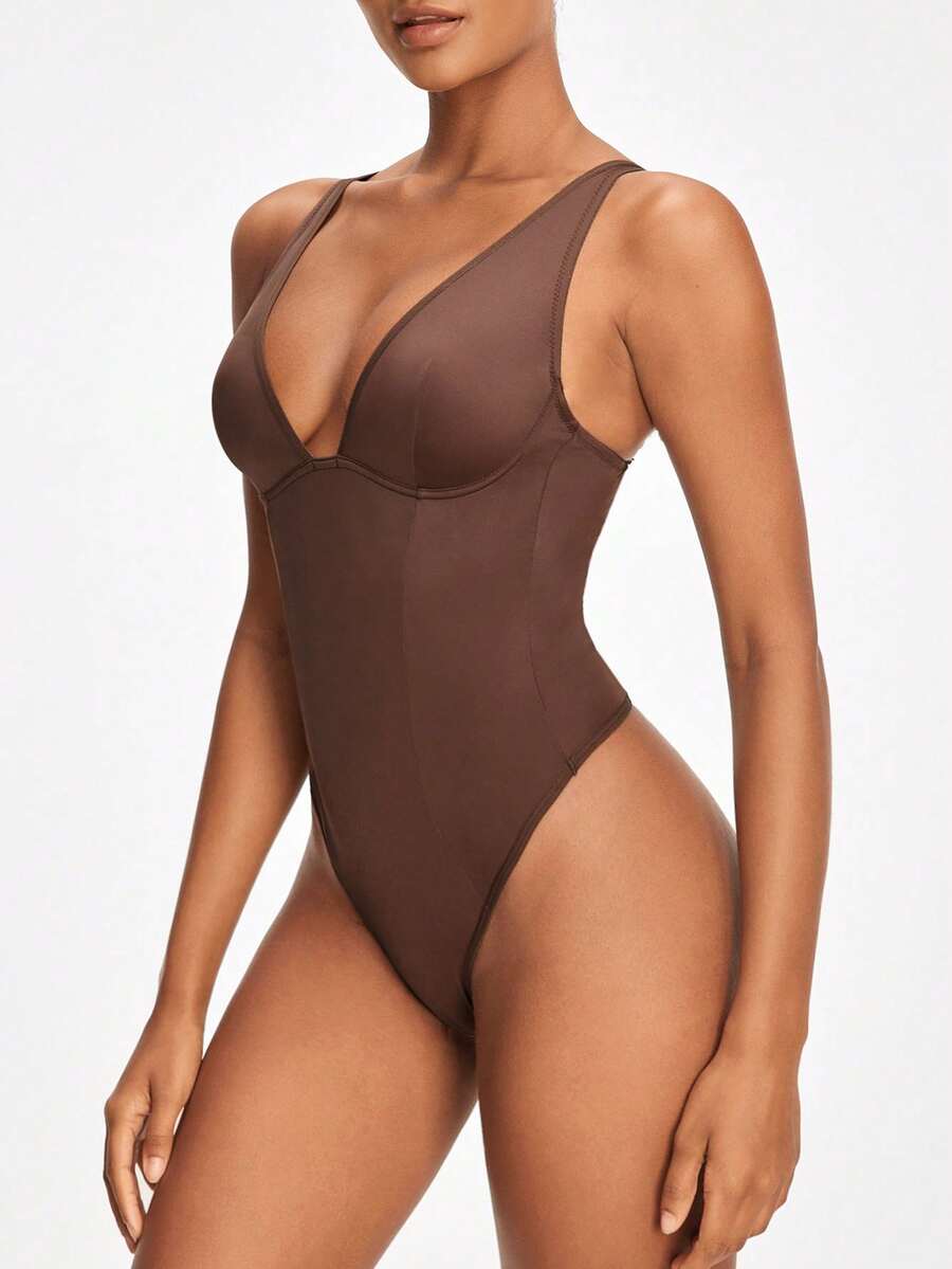 Apricot backless shapewear bodysuit with thong cut, cup details, and high-stretch fabric for light tummy support.