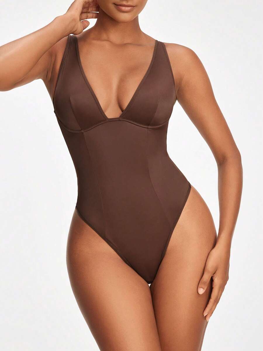 Apricot backless shapewear bodysuit with thong cut, cup details, and high-stretch fabric for light tummy support.