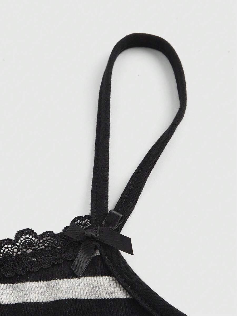 Burgundy rib-knit spaghetti strap camisole top featuring contrast lace patchwork trim, a decorative bow, and detailed cat embroidery.