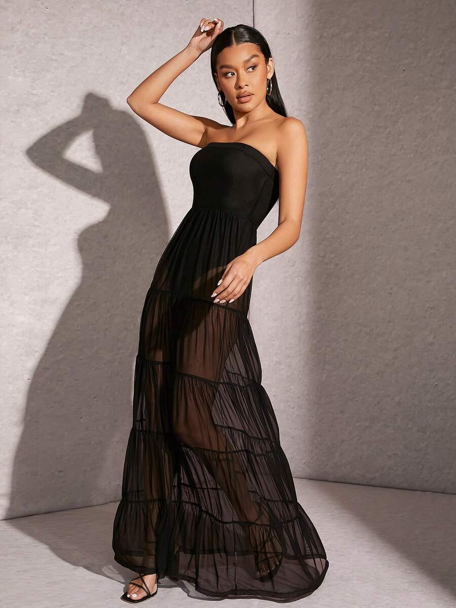 Hauture black strapless tiered maxi dress featuring a high waist, slim fit A-line silhouette, and semi-sheer contrast mesh hem for formal evening wear.