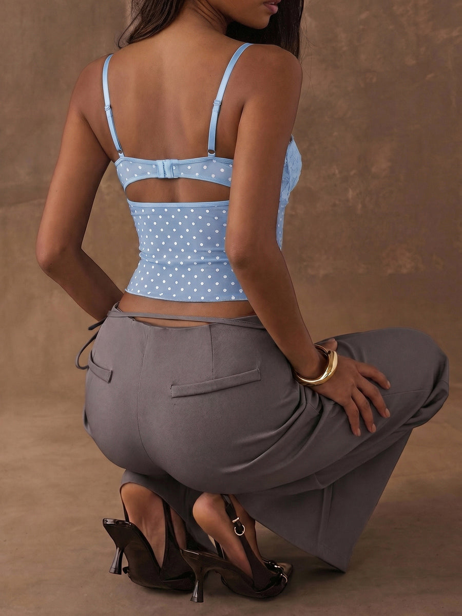 A black slim fit cropped camisole top featuring lace patchwork cup detail, spaghetti straps, and matching arm sleeves.
