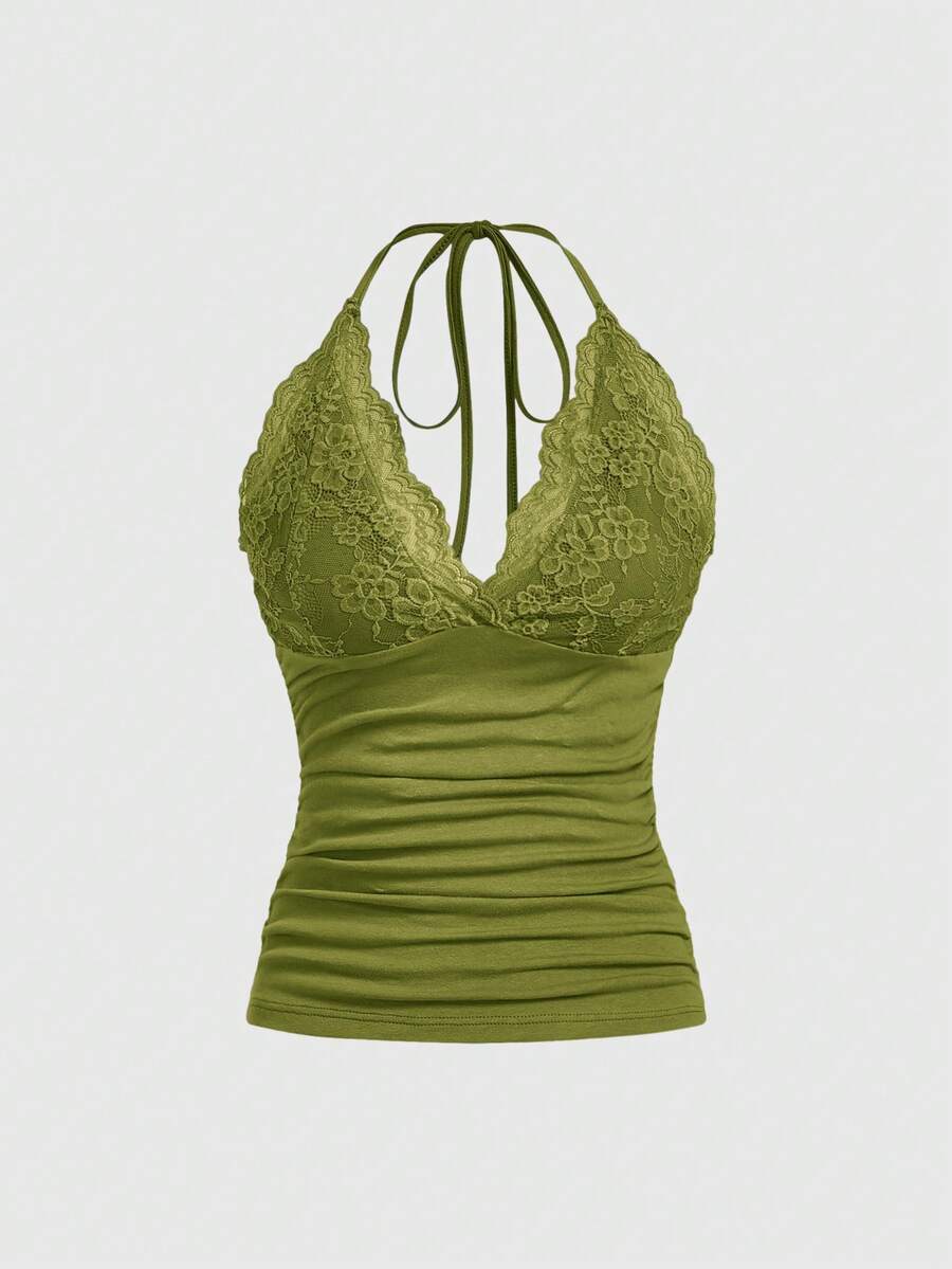 A women's black backless halter top featuring contrast lace trim, ruched front detail, and slim fit soft knitted fabric.