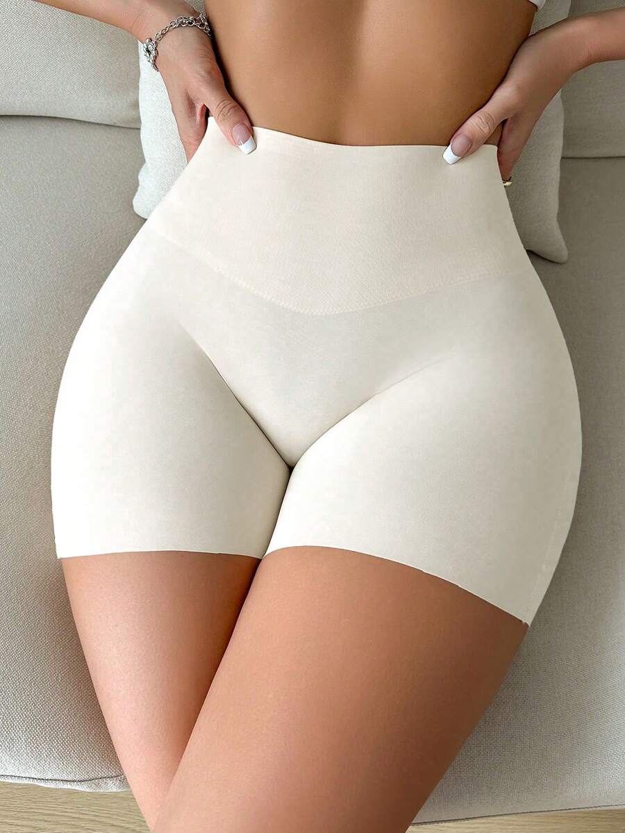 Women wearing apricot super high waist shapewear shorts designed for ultra-light thigh smoothing