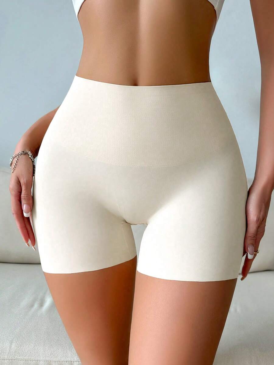 Women wearing apricot super high waist shapewear shorts designed for ultra-light thigh smoothing