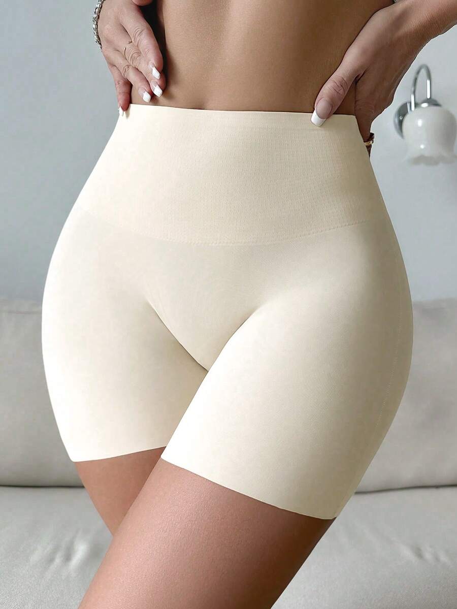 Women wearing apricot super high waist shapewear shorts designed for ultra-light thigh smoothing