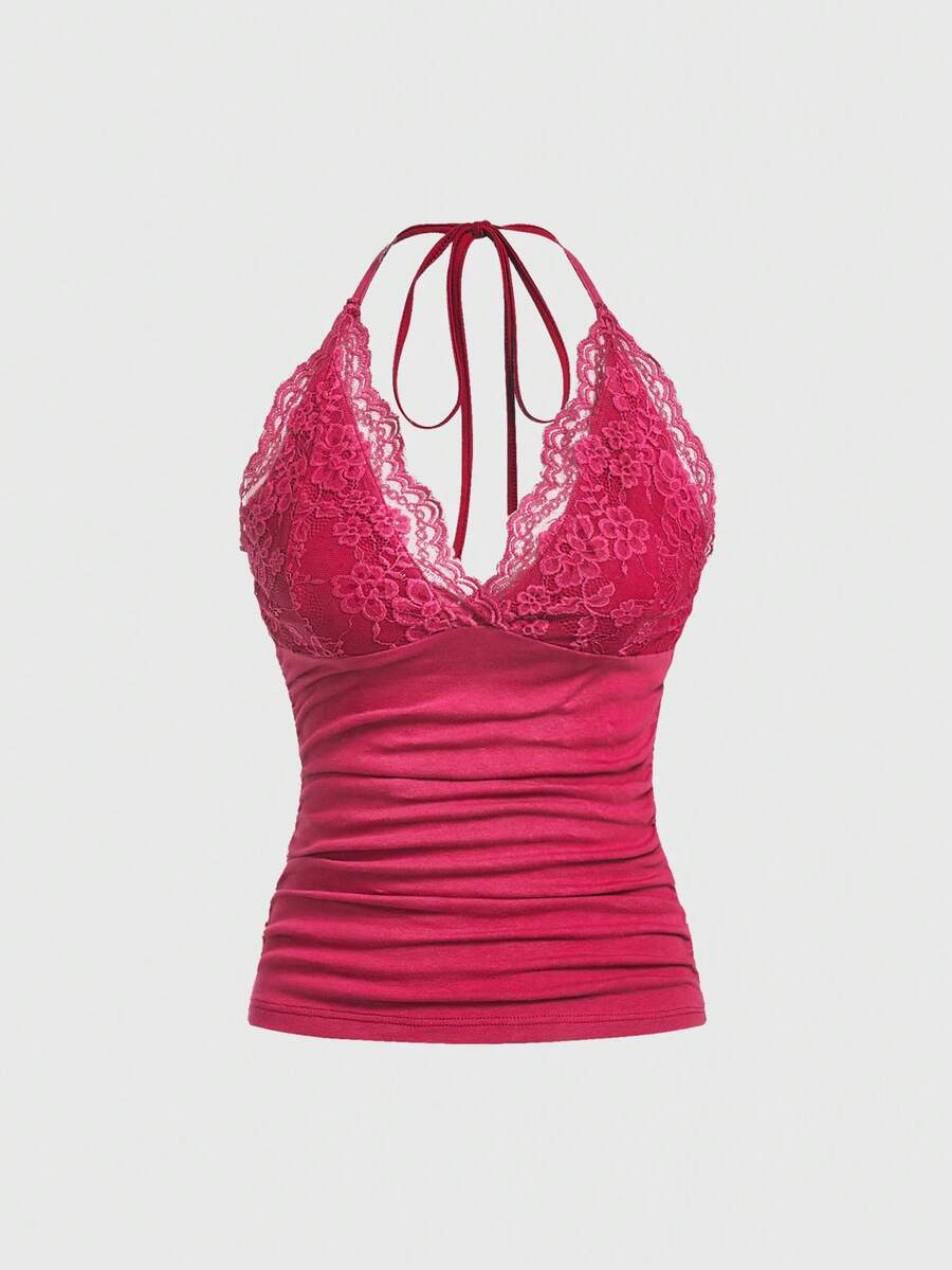 A women's black backless halter top featuring contrast lace trim, ruched front detail, and slim fit soft knitted fabric.