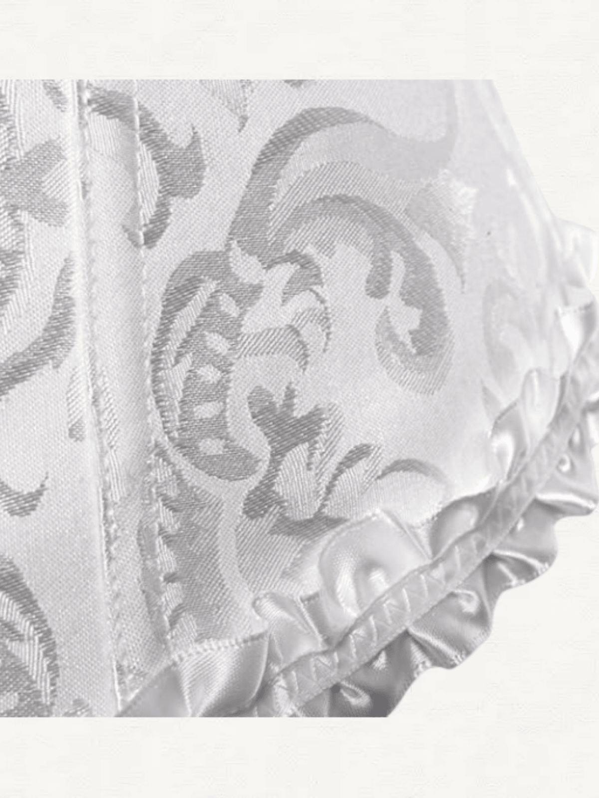Baroque open bust corset top with boning, ruffle details, and grommet eyelet accents for waist shaping and bust support.