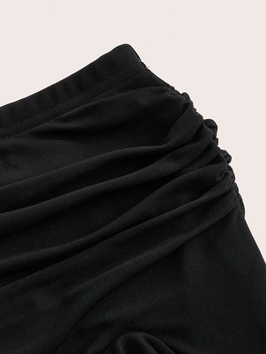 Women's black low rise asymmetrical midi skirt with ruched mesh fabric and layered ruffle hem