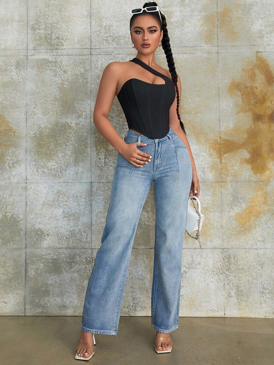 Women's black Y2K one-shoulder sleeveless backless crop top featuring an asymmetrical neckline and lace-up cutout design.