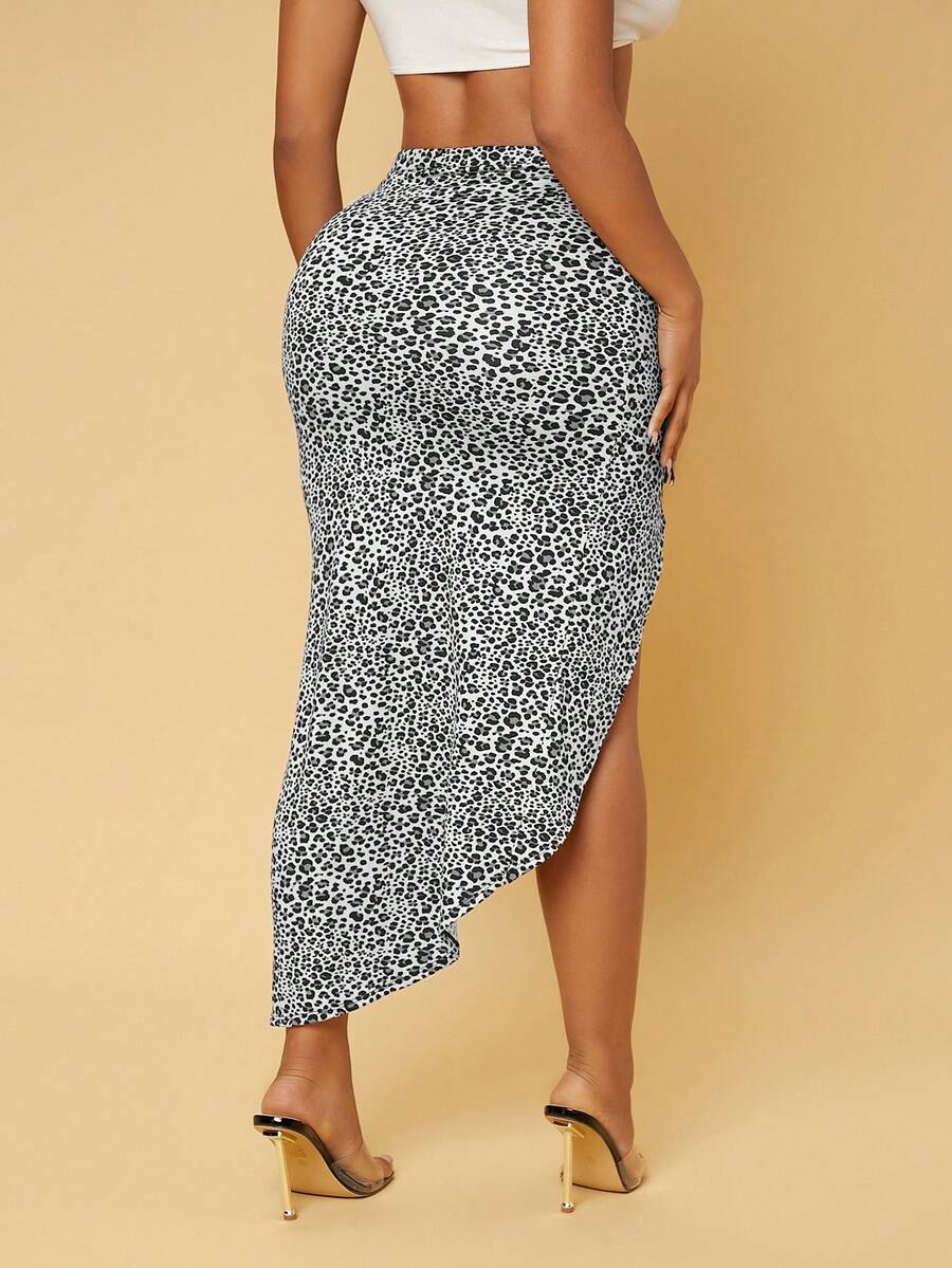Women's grey leopard print knit midi skirt featuring a high waist, twist front design, ruched detailing, and an asymmetrical split thigh.