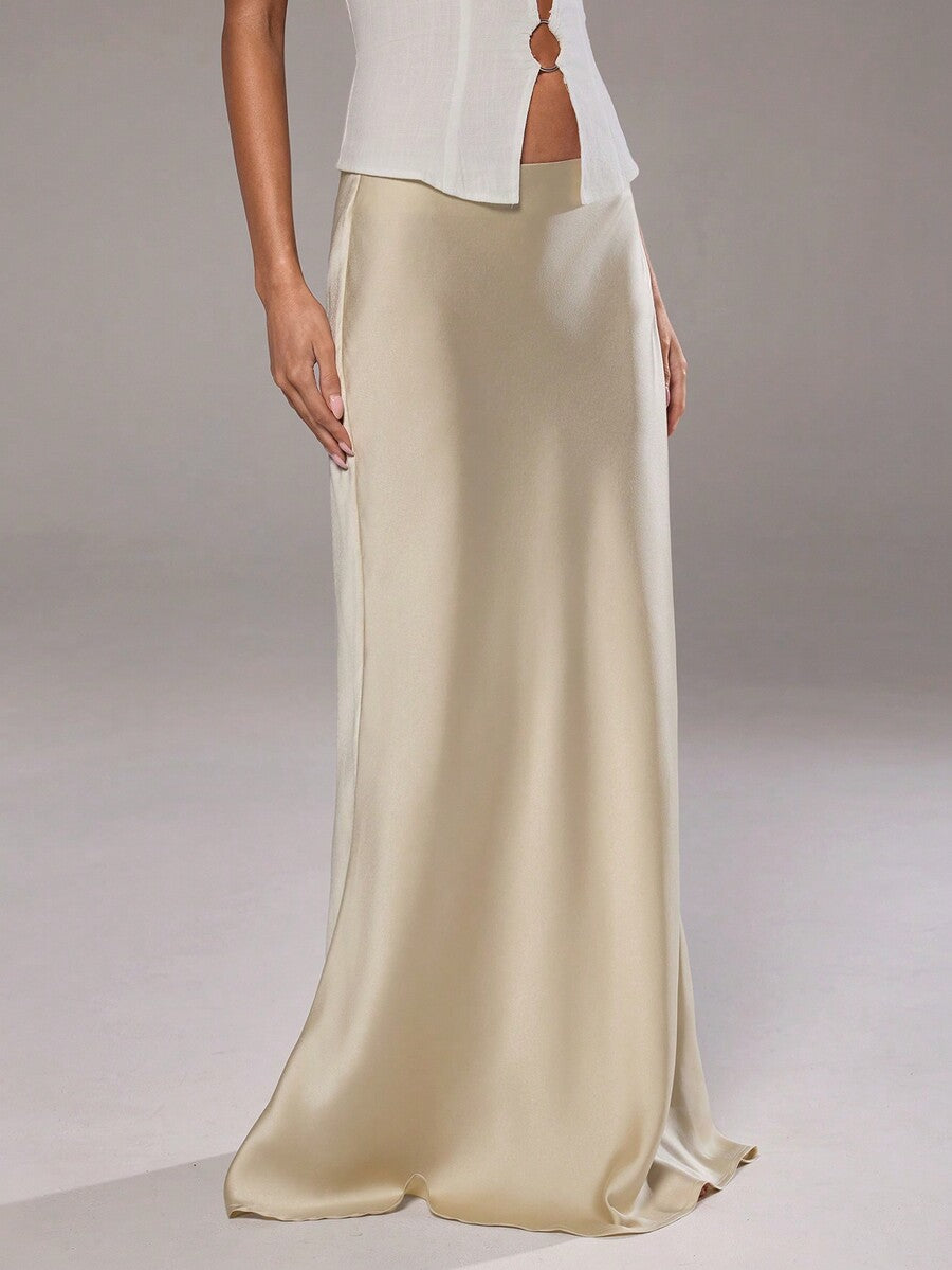 Women's khaki low-waisted maxi skirt featuring an elegant straight silhouette with a side split detail and zipper closure.